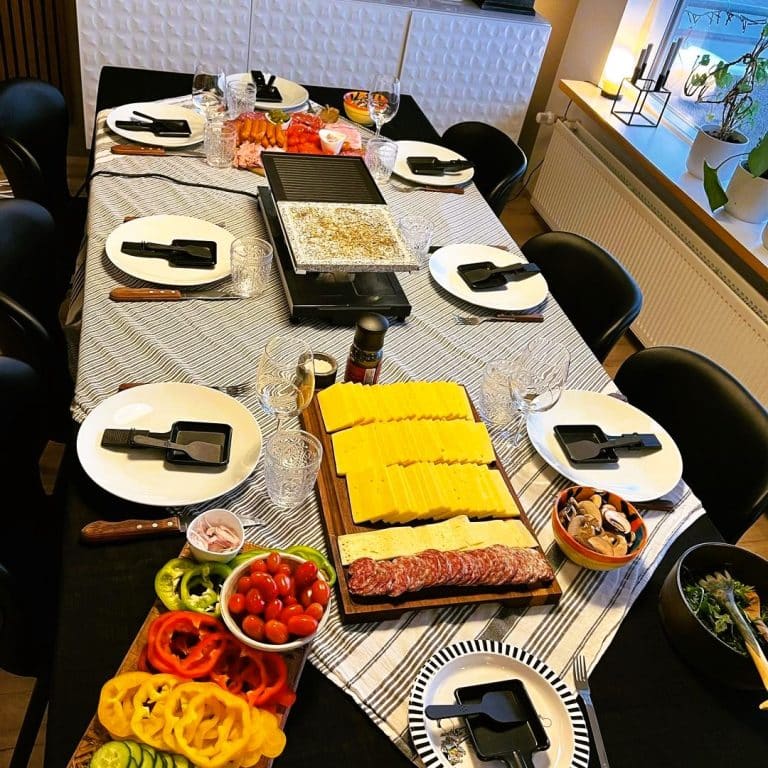 Raclette grill set with lots of cheese meat and veggies 57